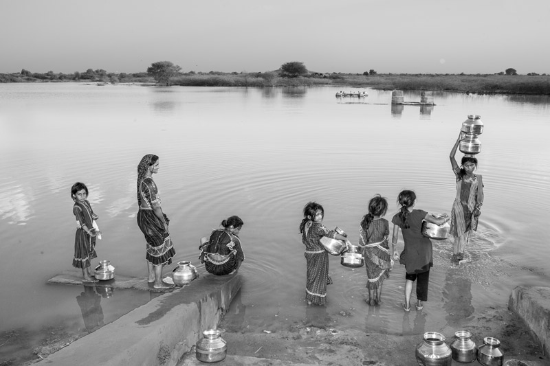 Human Right to Water in Kutch district, Gujarat - Collecting water from the village pond as a result of non-functional rural water supply scheme